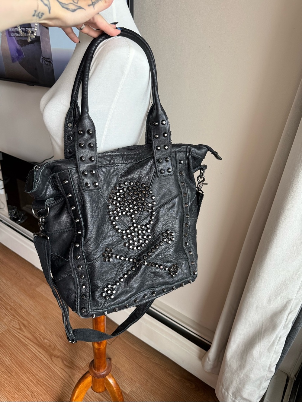 Studded Black Leather Tote Bag with Skull Accent